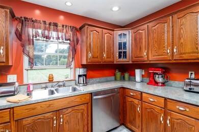 Kitchen featuring stainless steel dishwasher, brow