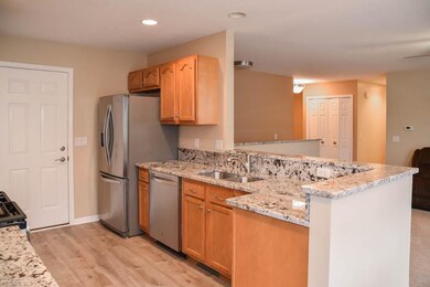 The kitchen has stainless steel appliances.