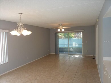 Great room with ceramic tile floor and ceiling fan