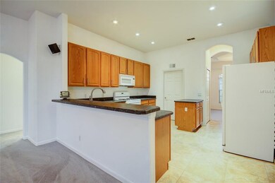 Kitchen leading to utility room and dining room