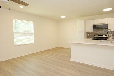 Kitchen featuring stainless steel stove, tasteful