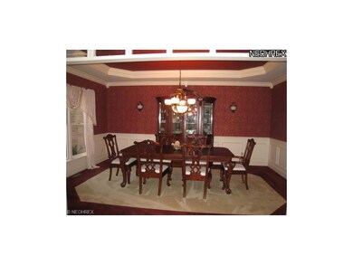 Formal dining room with crown molding, wainscottin