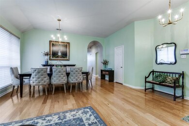 Dining space with light wood-type flooring, an inv