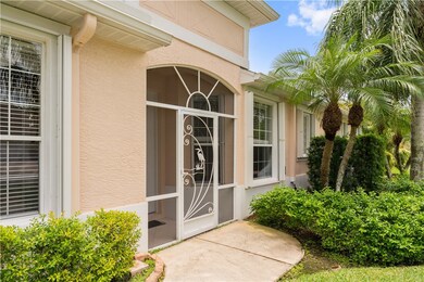 Side entry to villa w/screened entryway