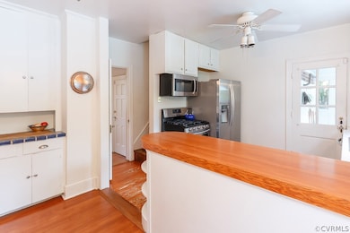 Kitchen has lots of storage cabinets and access to the mudroom.