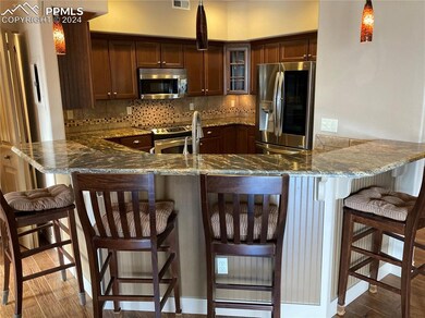 Bar top in kitchen with room for four high top sto