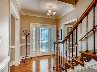 Warm and inviting Foyer with Newly refinished hard