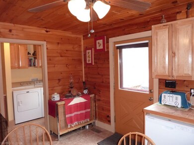Entry to laundry room/half bath combo and exit to 