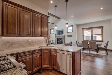 Open kitchen with granite countertops and stainles