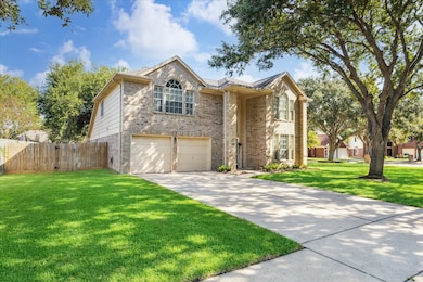 A double wide driveway provides ample parking and leads to the 2-car attached garage.