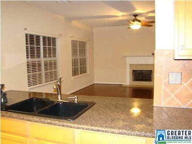 Kitchen has granite counter tops and open to famil