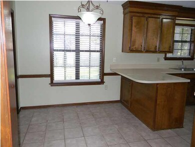 Dining area overlooks backyard