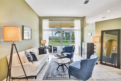 Living room overlooks the pool and lake