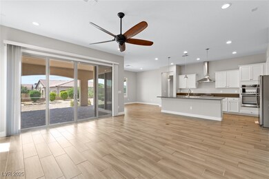 Unfurnished living room with ceiling fan, light wo