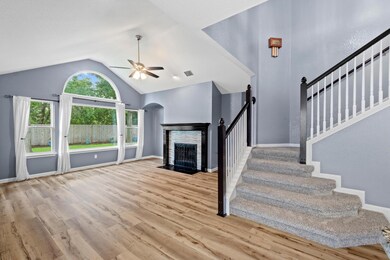 Unfurnished living room featuring vaulted ceiling