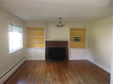 Dining Room with hardwood floors and wood burning 