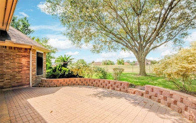 Enjoy tranquil golf course views and dappled shade from the extended patio—perfect for quiet mornings or entertaining under the trees.