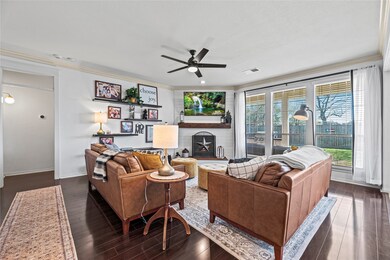 Spacious living room with updated fireplace and custom mantle.