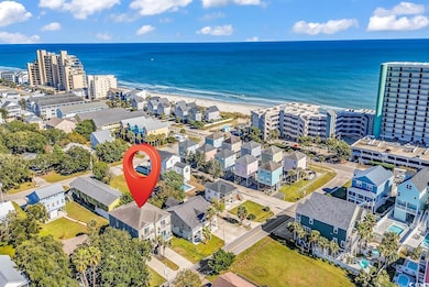 Bird's eye view of waterfront with a beach