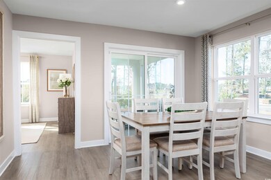 Dining space with hardwood / wood-style floors and
