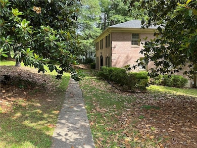 View of side of property with brick siding