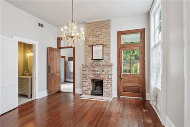 DINING W/ EXPOSED BRICK & UPDATED HALF BATH