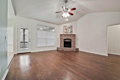 Open living room has a cathedral ceiling & access to the covered deck.