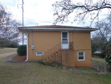 Right of house, kitchen entrance