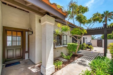Front door is a Dutch door.  Pergola over patio with door to family room.  A great place to entertain and relax.