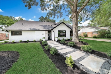 This home has gorgeous curb appeal situated on a q