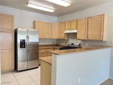 Kitchen with appliances with stainless steel finis