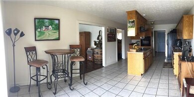 Spacious kitchen with plenty of cabinets and counter space.  Large eat-in kitchen has space for a large family table to look out over the pool area.  All appliances remain 