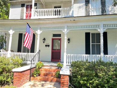 Closer view of front door and porch.