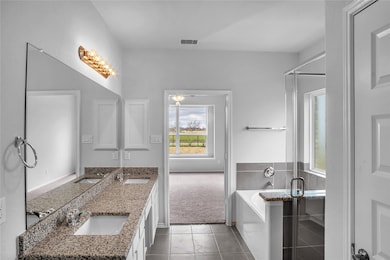 The Princeton II- Primary Bathroom with Dual Vanities, Separate Garden Tub and Walk-in Shower. Sample floor plan photo used for illustrative purposes only. Upgrades, selections options, windows and colors may vary.