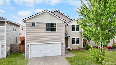 Two car attached garage plus driveway parking. Grass has been digitally edited for photos.