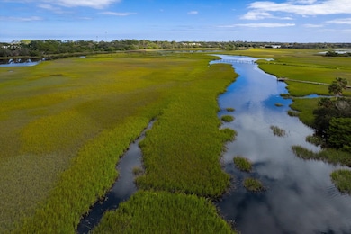 Aerial view of a large body of water and a golf course