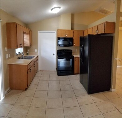 Kitchen with door to laundry room & garage