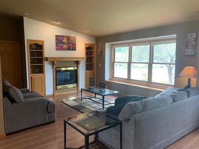 Living room with built ins, lots of natural light