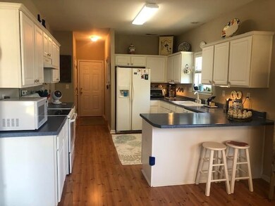 White cabinets, natural light make this a wonderfu