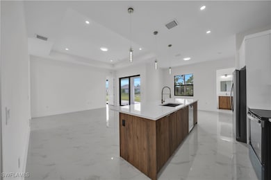 Kitchen with modern cabinets, stainless steel appl