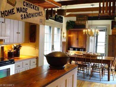 Kitchen opening to morning room is enhanced with 