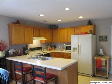 Kitchen view showing the bar eating area