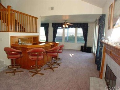 View from living room into family room and yard