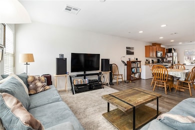Living room featuring recessed lighting and wood f