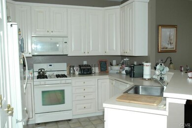Kitchen with gas stove and breakfast bar