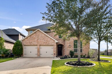 This incredible home is on a corner lot with gorgeous maturing trees and landscaping.