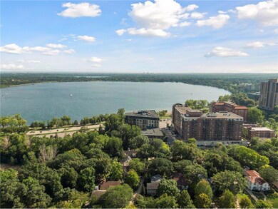 Aerial view of home tucked in the tree line with v