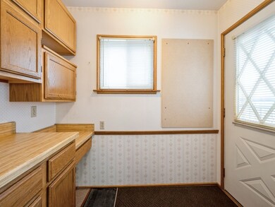 Side Entry with desk and extra cabinets