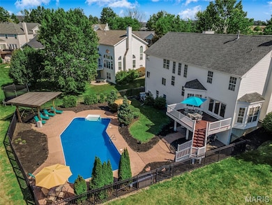 View of swimming pool featuring a patio area, a fenced backyard, a deck, and a residential view