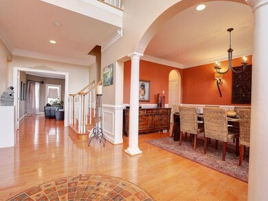 Natural light illuminates this grand 2 story entry